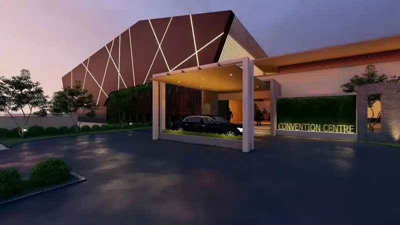 Large-format convention centre exterior at dusk, Kazhakootam, designed and built by Rzianz Infrastructures