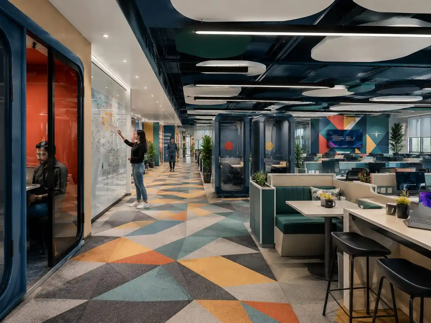 Office breakout zone with focus pods and booth seating, Trivandrum, designed and built by Rzianz Infrastructures