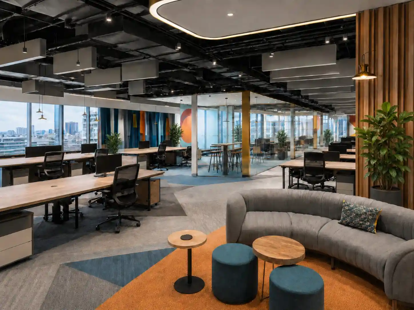 Office breakout lounge interior with curved seating, Trivandrum, designed and built by Rzianz Infrastructures