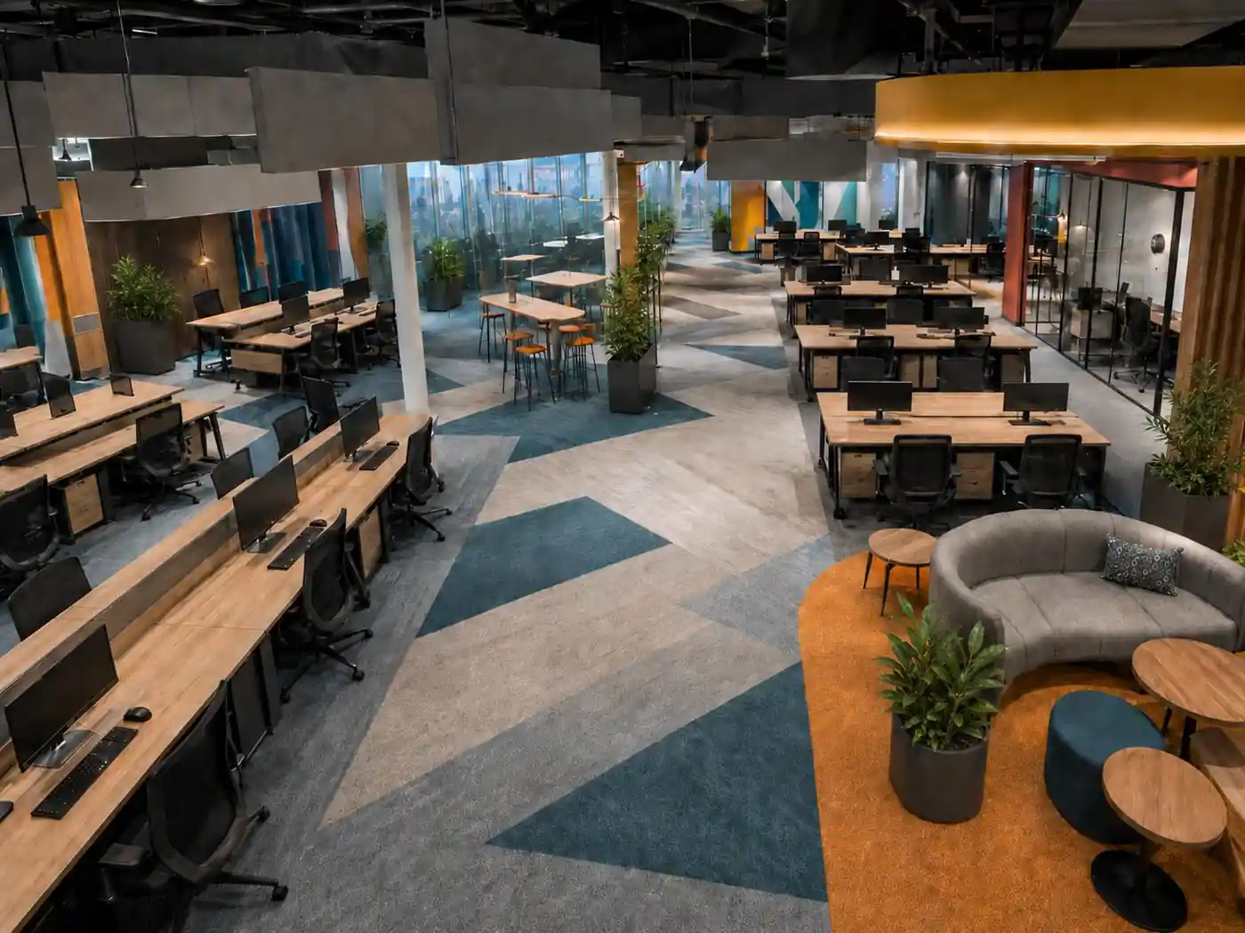 Open-plan office floor with workstations and breakout seating, Trivandrum, designed and built by Rzianz Infrastructures